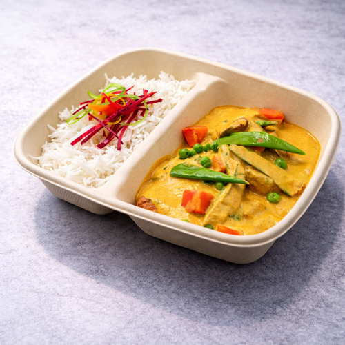 Red fish curry with vegetables served with white rice